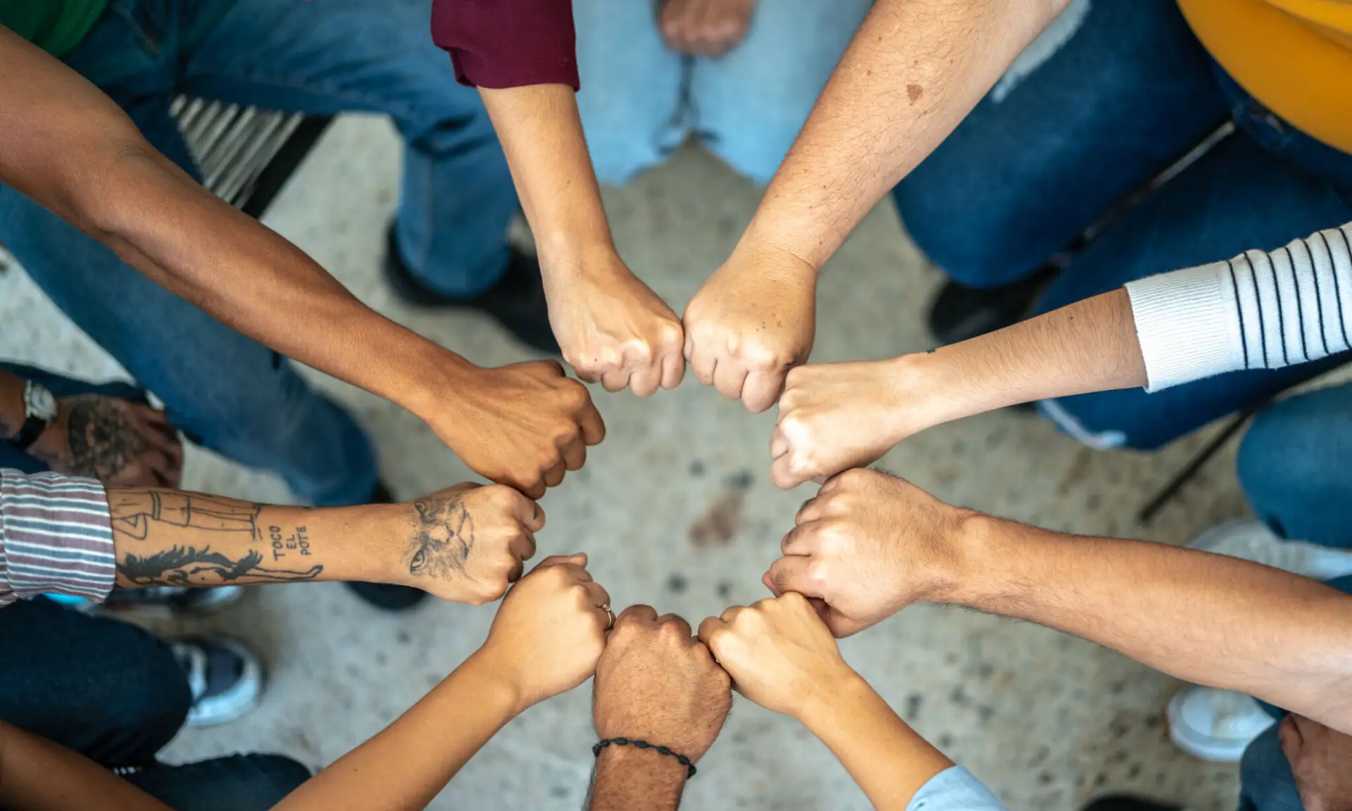 Close-up of a team doing fist bump